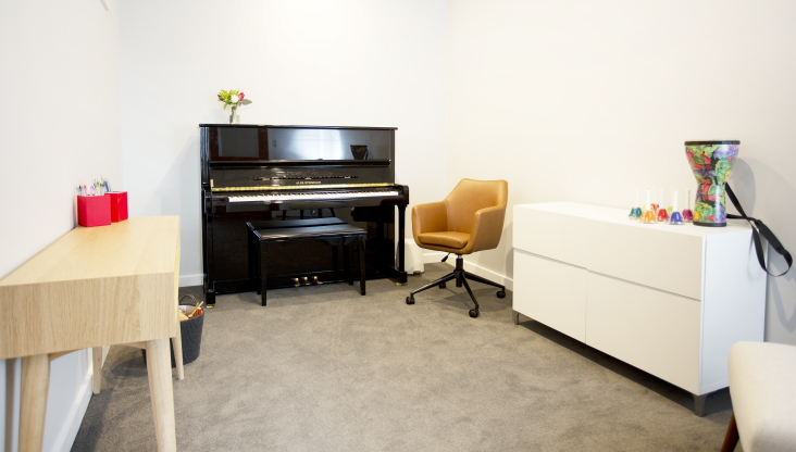 Studio space with piano and teaching materials